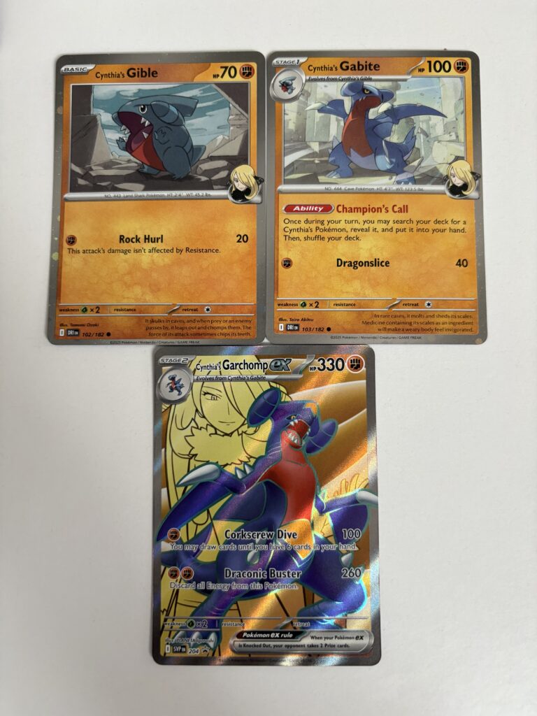 Trzy karty promocyjne Cynthia's Gible, Gabite i Garchomp ex.