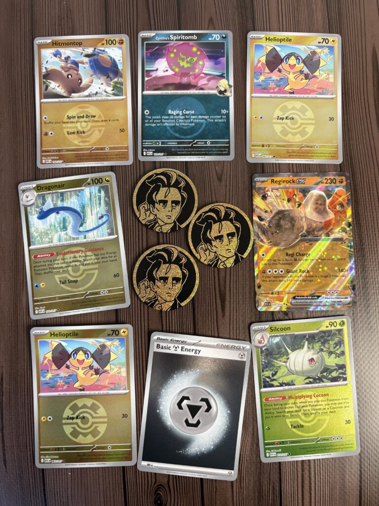 Karty Ascended Heroes z dwupacków Larry’s Komala