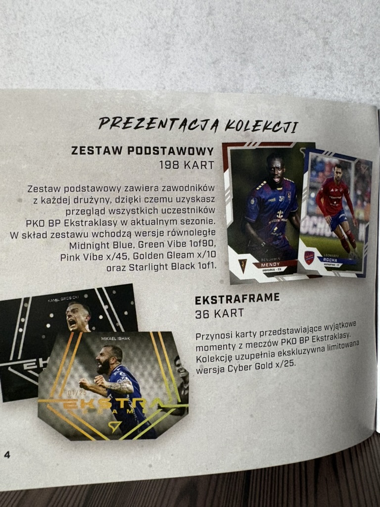 Strona przewodnika z opisem kart podstawowych i insertów EkstraFrame.